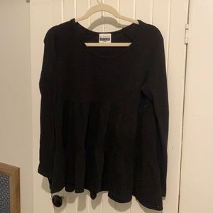 Women’s baby doll style long sleeve shirt.